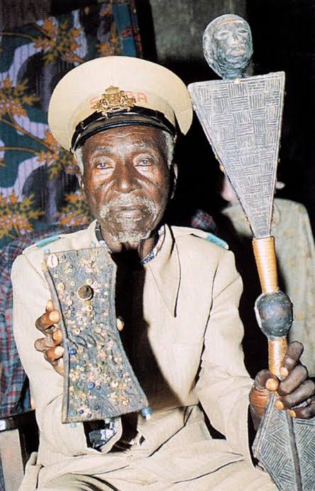 Chief holding a lukasa memory board